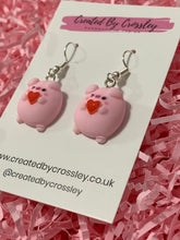 Load image into Gallery viewer, Heart Holding Flirty Pig Charm Earrings