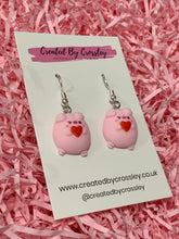 Load image into Gallery viewer, Heart Holding Flirty Pig Charm Earrings