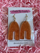 Load image into Gallery viewer, Bronze Shimmer Arch Resin Earrings
