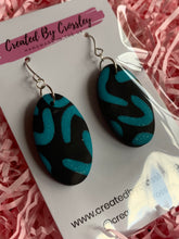 Load image into Gallery viewer, Black Blue Oval Clay Earrings
