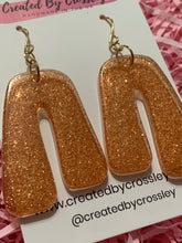 Load image into Gallery viewer, Bronze Shimmer Arch Resin Earrings
