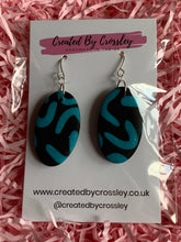 Load image into Gallery viewer, Black Blue Oval Clay Earrings
