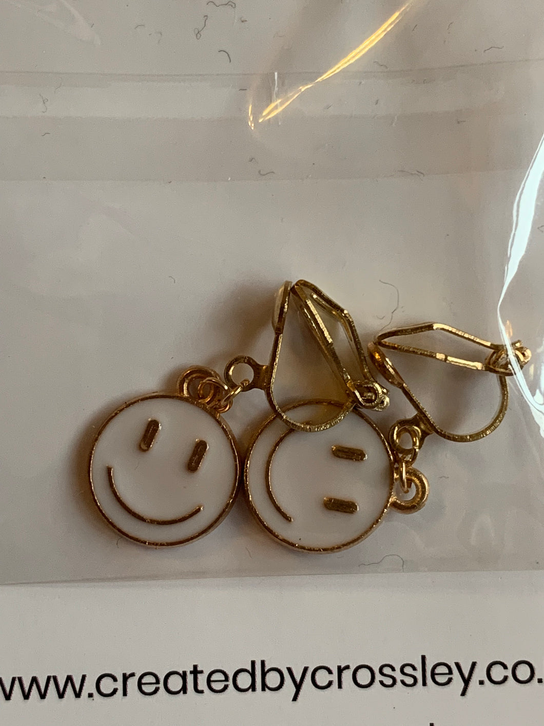 White Smiley Face Clip On Earrings