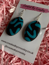 Load image into Gallery viewer, Black Blue Oval Clay Earrings
