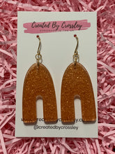 Load image into Gallery viewer, Bronze Shimmer Arch Resin Earrings
