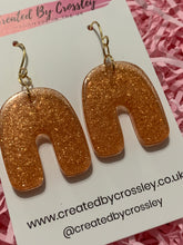 Load image into Gallery viewer, Bronze Shimmer Arch Resin Earrings
