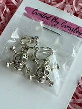 Load image into Gallery viewer, Skull and Cross Bones Clip On Earrings
